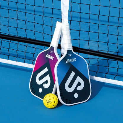 2 raquettes Smart & Pro SKINUP SPORT - sur le terrain avec une balle et le filet